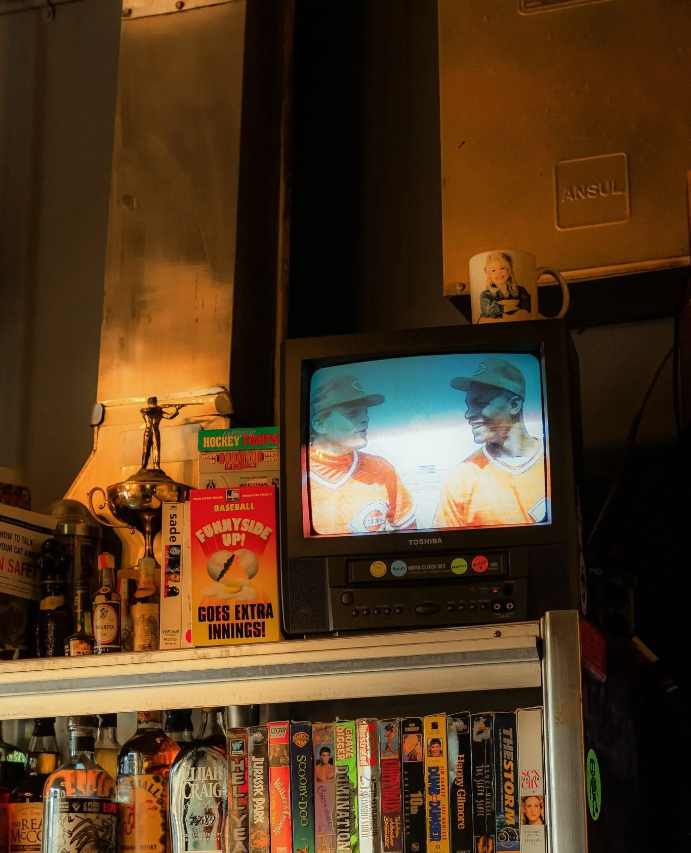 A hot dog and cocktail at the bar